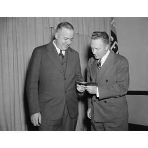  1937 photo Admiral Byrd admires medal awarded to aide on 