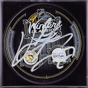  Karl Alzner Autographed Puck   2011 Winter Classic Dueling 