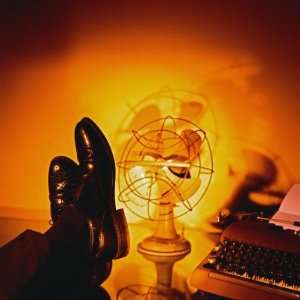 Feet Resting on Desk with Vintage Fan and Typewriter Photographic 