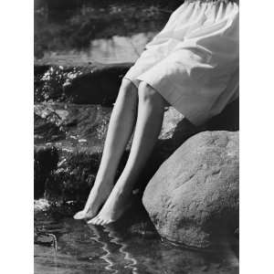 Woman Sitting on Rock With Feet in Water, Low Section 