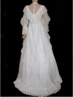 This 70s wedding dress features a shawl collar and poet sleeves, in a 