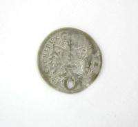 THE COIN IS SCUFFED WITH A HOLE. THE SIZE IS ABOUT 1.9 CM DIAMETER AND 