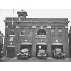  Fire Trucks Sitting Ready to Go at a Firehouse Premium 