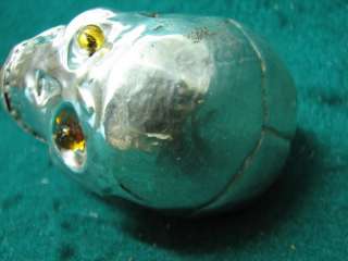   , sterling silver human skull with glass eyes, a very good art work