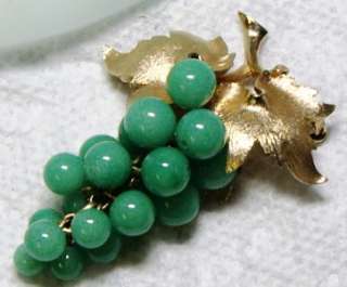 The Green Grape Cluster has jade green beads that have been wired 