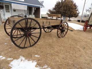 This antique Newton horse drawn wagon has been weather treated and the 