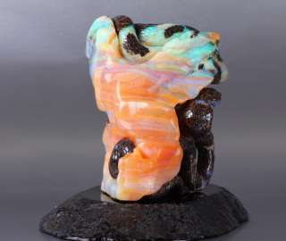 This is a Matrix Opal skull and snakes in Black Onyx stand. Its 3.4 