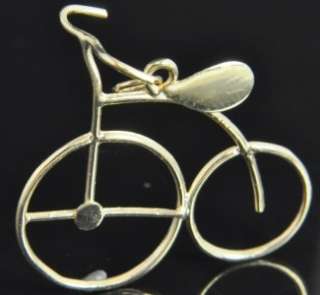   big wheel bicycle charm pendant crafted from solid 14K yellow gold