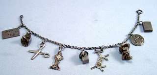 Up for auction is a great vintage sterling silver charm bracelet. This 
