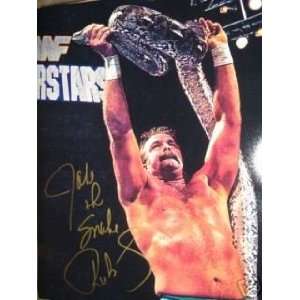  JAKE THE SNAKE ROBERTS AUTOGRAPHED SIGNED 16X20 HOLDS UP THE SNAKE 