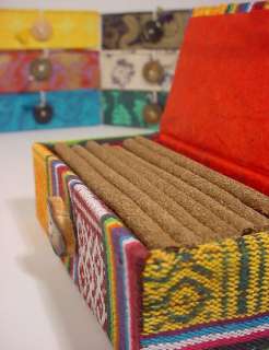 tibetan incense in handmade paper box filled with incense sticks
