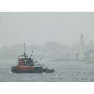  A Tugboat Travels Through Fog Past New London Harbor Light 