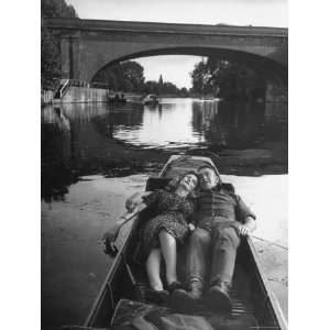  British Couple Lying in a Small Boat Together, Looking Up 